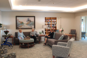 Residents chatting in a common area at Stonehill Communities